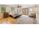 Large bedroom with beautiful hard wood floors, ceiling fan and access to the outside balcony at 11796 W 53Rd Pl, Arvada, CO 80002
