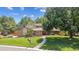 Beautifully landscaped front yard with mature trees and a charming walkway leading to the front door at 11796 W 53Rd Pl, Arvada, CO 80002