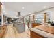 Open concept kitchen with stainless appliances, double islands, and views to the living room and backyard at 11796 W 53Rd Pl, Arvada, CO 80002