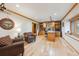 Spacious office featuring custom built-in shelving, hardwood floors, and large window at 11796 W 53Rd Pl, Arvada, CO 80002