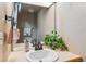 Bathroom with a white sink, tan walls, and a mirror, as well as a plant at 7696 S Monaco E Cir, Centennial, CO 80112