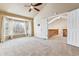 Spacious bedroom with vaulted ceilings, a ceiling fan, and large window at 7696 S Monaco E Cir, Centennial, CO 80112