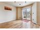Dining area with wood floors and sliding glass doors leading to the deck at 7696 S Monaco E Cir, Centennial, CO 80112