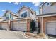 Charming townhome featuring a well-manicured lawn and an attached one car garage at 7696 S Monaco E Cir, Centennial, CO 80112