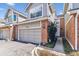 Charming townhome featuring a well-manicured lawn and an attached one car garage at 7696 S Monaco E Cir, Centennial, CO 80112