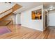 Open-concept living room featuring wood floors and a view to the kitchen at 7696 S Monaco E Cir, Centennial, CO 80112