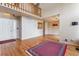 Spacious living room features wood floors, a staircase, and neutral walls at 7696 S Monaco E Cir, Centennial, CO 80112