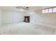 Finished basement featuring a brick fireplace and tiled flooring at 2866 Bellaire St, Denver, CO 80207
