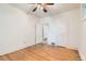 A bedroom with wood floors and a ceiling fan at 2866 Bellaire St, Denver, CO 80207