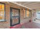 Close up of the front door and windows in a charming brick home at 2866 Bellaire St, Denver, CO 80207