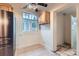 Corner kitchen area with a window and appliances at 2866 Bellaire St, Denver, CO 80207