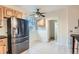 Kitchen featuring stainless steel refrigerator and natural light at 2866 Bellaire St, Denver, CO 80207