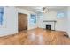 Spacious living room featuring hardwood floors and a cozy fireplace at 2866 Bellaire St, Denver, CO 80207