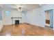 Bright living room with hardwood floors and a classic fireplace at 2866 Bellaire St, Denver, CO 80207