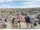 Stunning aerial view of a home with a tile roof in a neighborhood, showcasing community layout at 10662 Skydance Dr, Highlands Ranch, CO 80126