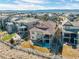Stunning aerial view of the home, showcasing the backyard and the community at 10662 Skydance Dr, Highlands Ranch, CO 80126