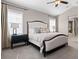 Cozy bedroom with neutral decor, carpet, and large windows providing lots of natural light at 10662 Skydance Dr, Highlands Ranch, CO 80126