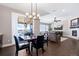 Open-concept dining area with a view of an outdoor deck and a glimpse into the living room at 10662 Skydance Dr, Highlands Ranch, CO 80126