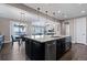 Open concept kitchen featuring a large island with granite countertops and stainless steel appliances at 10662 Skydance Dr, Highlands Ranch, CO 80126