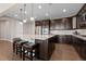 Spacious kitchen island offering room for seating, cooking, and entertaining at 10662 Skydance Dr, Highlands Ranch, CO 80126
