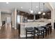 Spacious kitchen featuring dark wood cabinets, a large island, granite countertops, and stainless steel appliances at 10662 Skydance Dr, Highlands Ranch, CO 80126
