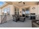 Relax on this covered patio with comfortable seating and a built-in grill, perfect for outdoor entertaining at 10662 Skydance Dr, Highlands Ranch, CO 80126