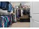 Spacious walk-in closet with ample storage and organization solutions at 10662 Skydance Dr, Highlands Ranch, CO 80126