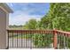Balcony view overlooking a well-manicured green space and neighboring trees at 8635 Clay St # 417, Westminster, CO 80031