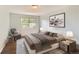 Serene bedroom is adorned with soft colors, ambient lighting, and a cozy accent chair, offering a tranquil retreat at 8635 Clay St # 417, Westminster, CO 80031