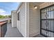 View of the building exterior with a secure front door and tidy siding at 8635 Clay St # 417, Westminster, CO 80031