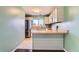 Modern kitchen has stainless steel appliances, breakfast bar seating, and sleek finishes, creating an inviting culinary space at 8635 Clay St # 417, Westminster, CO 80031