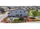 Aerial view of a two-story home with a manicured lawn and a fenced backyard at 10016 Hough Pt, Parker, CO 80134
