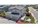 Aerial view of a lovely two-story home with a three car garage and a well-kept lawn at 10016 Hough Pt, Parker, CO 80134