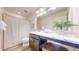 Well-lit bathroom with stylish vanity, and neutral color scheme at 10016 Hough Pt, Parker, CO 80134