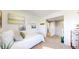 Cozy bedroom featuring white walls, neutral carpet, coastal décor, and natural light at 10016 Hough Pt, Parker, CO 80134