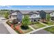 Charming two-story home with manicured lawn, beautiful landscaping, and a welcoming front porch at 10016 Hough Pt, Parker, CO 80134