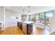 Modern kitchen island with white countertop and stainless steel dishwasher, complementing the open living space at 10016 Hough Pt, Parker, CO 80134