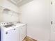 Functional laundry room with modern washer and dryer units for convenient chores at 10016 Hough Pt, Parker, CO 80134