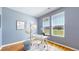 Bright home office with large windows, hardwood floors, and modern decor, creating a productive workspace at 10016 Hough Pt, Parker, CO 80134