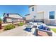 Backyard patio area with comfortable seating and a modern fire pit for outdoor entertaining at 10016 Hough Pt, Parker, CO 80134