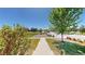 Inviting street view showcasing a well-maintained lawn and beautiful landscaping at 10016 Hough Pt, Parker, CO 80134