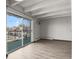 Living room featuring a walk-out balcony with decorative railings and neighborhood views at 100 S Clarkson St # 303, Denver, CO 80209