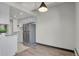 Kitchen with modern stainless steel appliances, granite countertops, light colored cabinets and an open concept to the living area at 100 S Clarkson St # 303, Denver, CO 80209