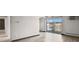 Bright living room featuring a walk-out balcony with decorative railings and neighborhood views at 100 S Clarkson St # 303, Denver, CO 80209