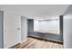 This bedroom has modern wood-look floors and is freshly painted in gray at 1255 Nelson St, Lakewood, CO 80215
