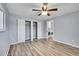 A large, airy bedroom with a large closet and a washing machine and dryer in the next room at 1255 Nelson St, Lakewood, CO 80215