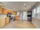 Well-equipped kitchen with stainless steel appliances and washer and dryer at 1255 Nelson St, Lakewood, CO 80215