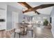 A cozy room with natural wood beams, laminate floors, and modern decorations at 1255 Nelson St, Lakewood, CO 80215