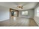 Bright, open-concept living room with large windows and modern flooring at 1255 Nelson St, Lakewood, CO 80215