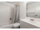 Full bathroom with tiled walls and a modern vanity with a sink at 1050 S Monaco Pkwy # 77, Denver, CO 80224
